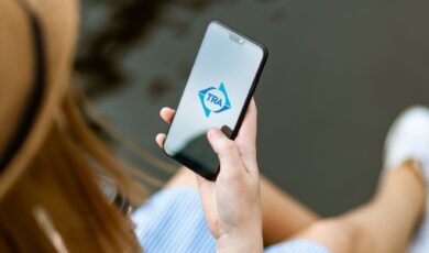 TRA Mobile App on a woman's phone