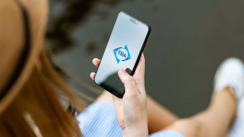 TRA Mobile App on a woman's phone