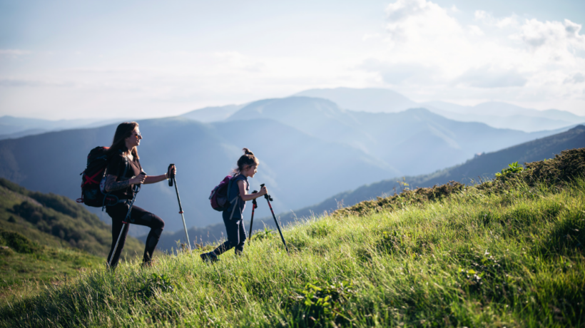 Migraine free woman enjoying a hike with her daughter